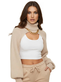 Thumbnail for Woman wearing an off white sweater with cut-out design over a white top and beige pants on a white background