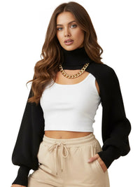 Thumbnail for Woman wearing a black cardigan, white top, and beige pants on a white background