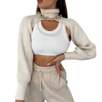 Thumbnail for Woman wearing a beige ribbed sweater, white crop top, and beige pants on a white background
