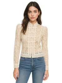 Thumbnail for Woman wearing a beige lace blouse and blue jeans on a white background