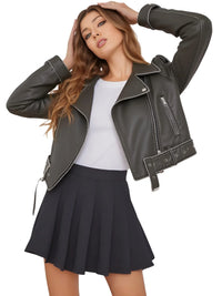 Thumbnail for Woman wearing a coal grey leather jacket, white top, and black pleated skirt on a white background