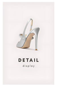 Thumbnail for Silver high-heeled shoe with a detailed sole on a light gray background