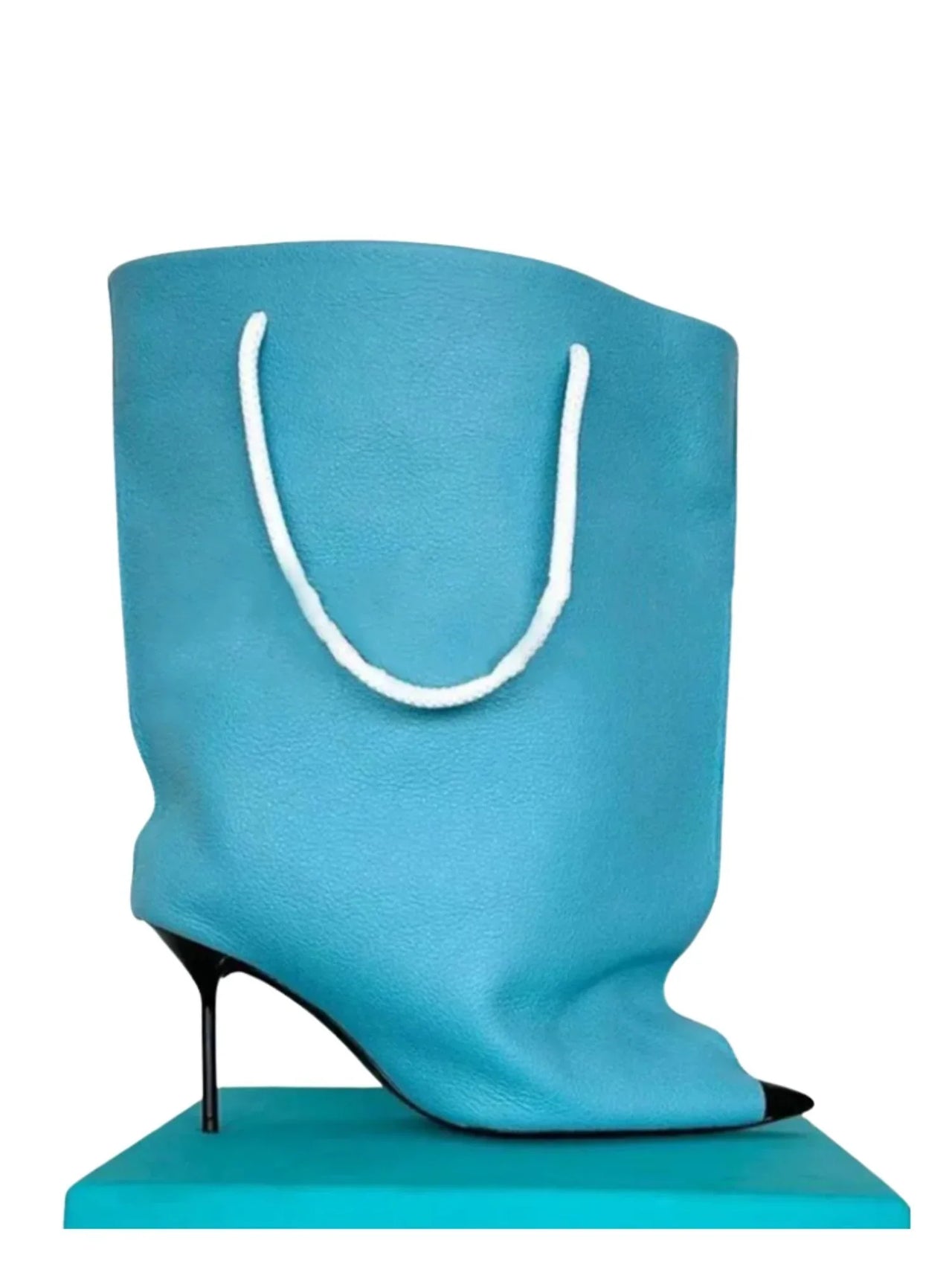 Blue high-heeled ankle boot with a white handle on a white background