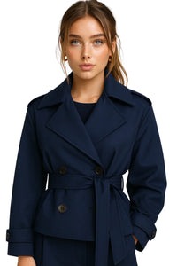 Thumbnail for Woman wearing a dark blue cropped trench coat on a white background