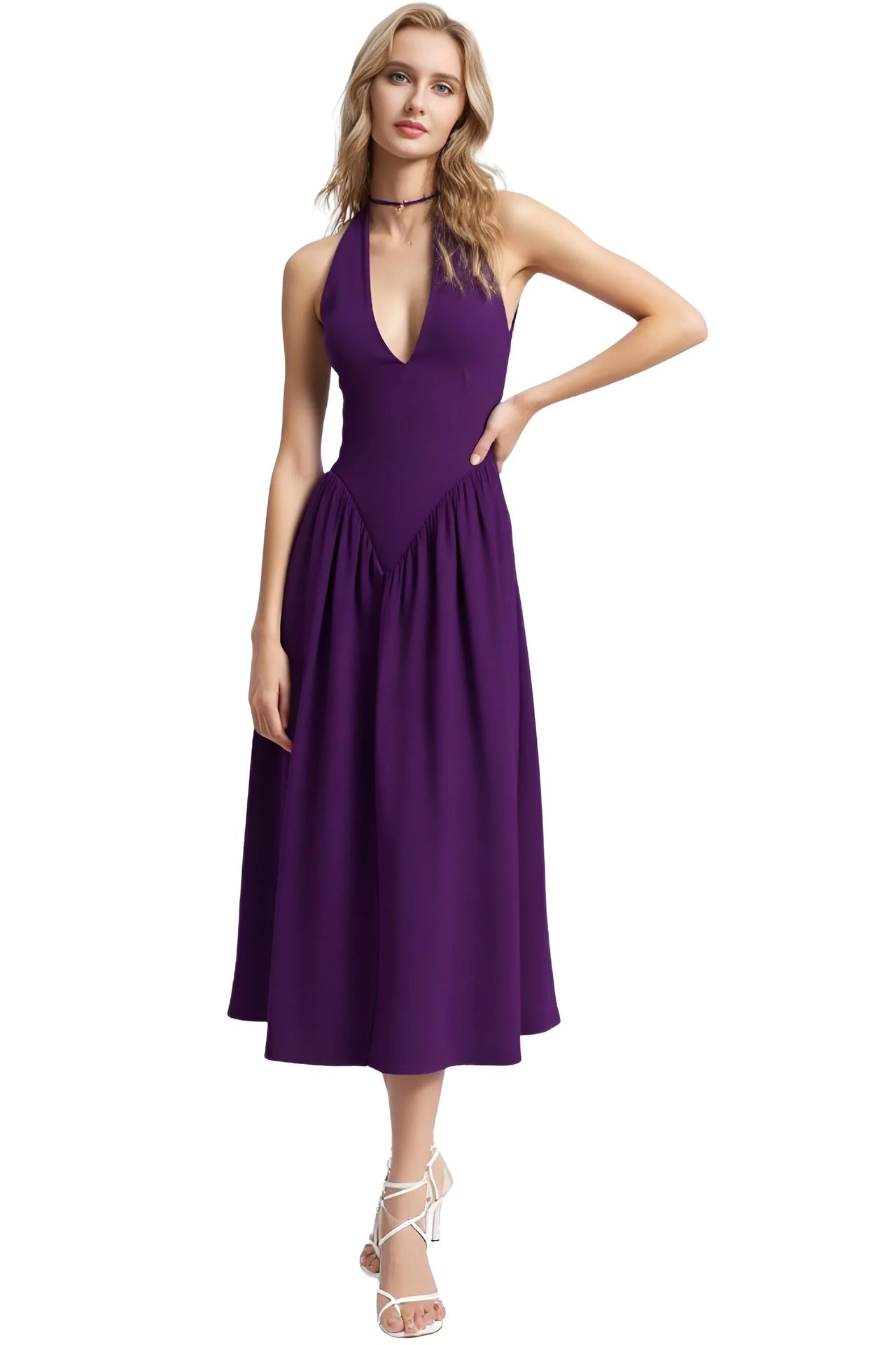 Woman wearing a purple halter neck dress on a white background