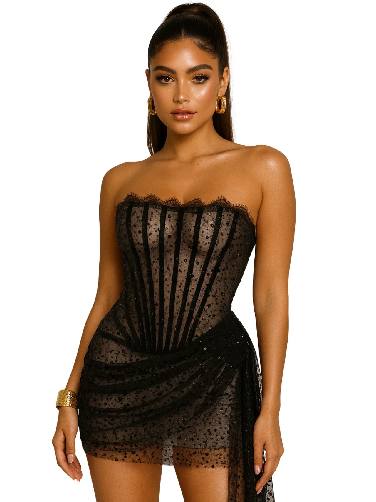 Woman wearing a black strapless dress with lace and sequins details on a white background
