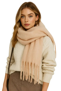 Thumbnail for Woman wearing a blush scarf and sweater on a white background