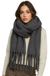 Thumbnail for Woman wearing a dark gray scarf with fringes on a white background