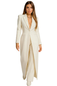 Thumbnail for Woman wearing a long, off-white blazer and pantsuit on a white background