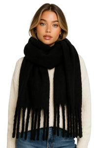 Thumbnail for Woman wearing a black blanket scarf with fringe on a white background
