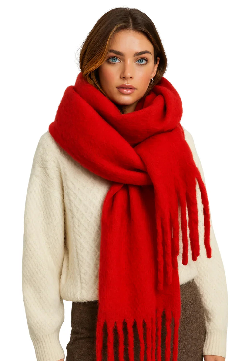 Woman wearing a red blanket scarf and cream sweater on a white background