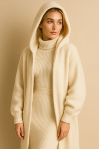 Thumbnail for Woman wearing a cream-colored hooded coat over a matching dress against a beige background