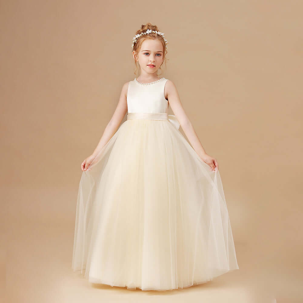 Elegant custom made sleeveless bow wedding flower girl dress is a perfect option for your flower girl. Quality fabric, scoop neckline and A-line tulle skirt.