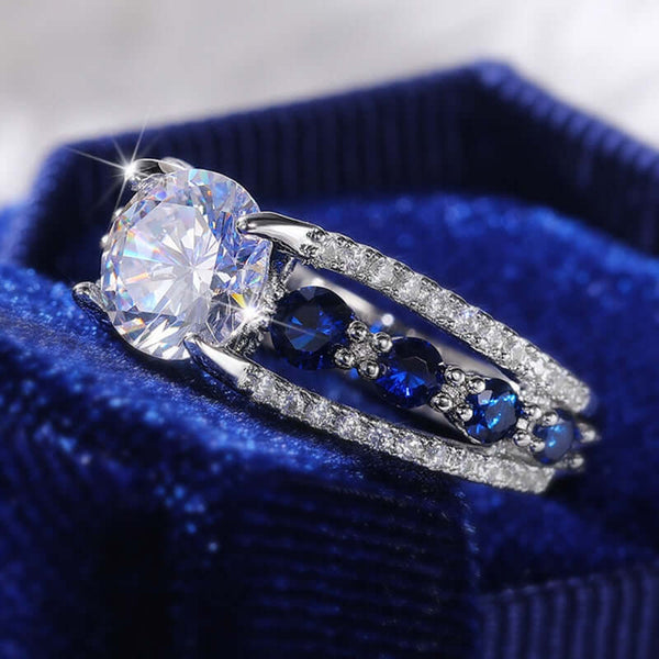 Free Shipping + We'll Pay The Tax! A stunning ring with a blue and white round cubic zirconia stone. Add this beautiful ring to your jewelry collection.