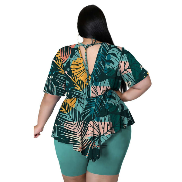 A classy two piece set features a flattering top with a tropical design, plus  matching shorts. Wear with your favorite pair of strappy heels and a cute clutch.