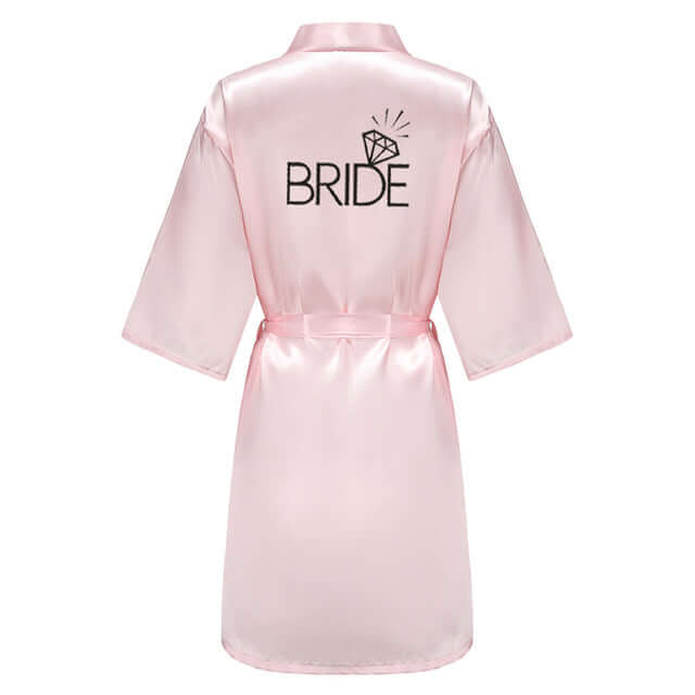 Elevate your wedding party with light pink satin kimono robes from Drestiny. Enjoy free shipping and tax covered. Limited time offer - save up to 50%!